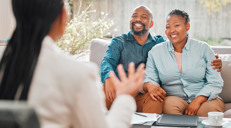 People, couple and smile with broker at home for funeral cover or life policy planning. Relationship, meeting and happy with financial advisor for advice on house insurance with paperwork People, couple and smile with broker at home for funeral cover or life policy planning. Relationship, meeting and happy with financial advisor for advice on house insurance with paperwork.